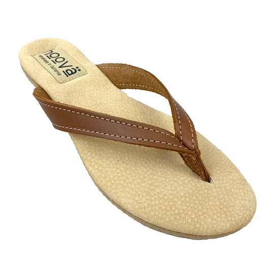 Beige sandal with brown strap on a white background
